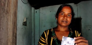 Photo: Amantha Perera/IRIN Vijitha Pavanendran holds a photo of her husband who was killed by unknown attackers during the civil war
